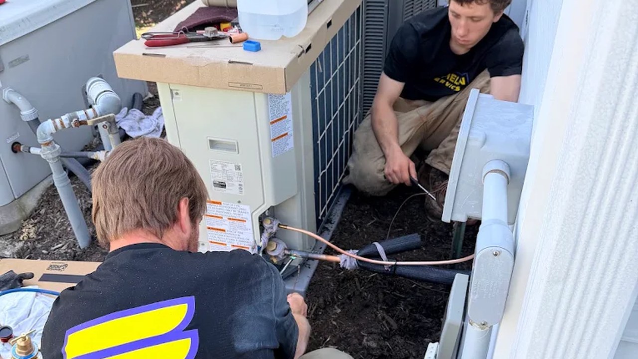 Echelon Services technicians working on an outdoor AC unit in Brick, NJ